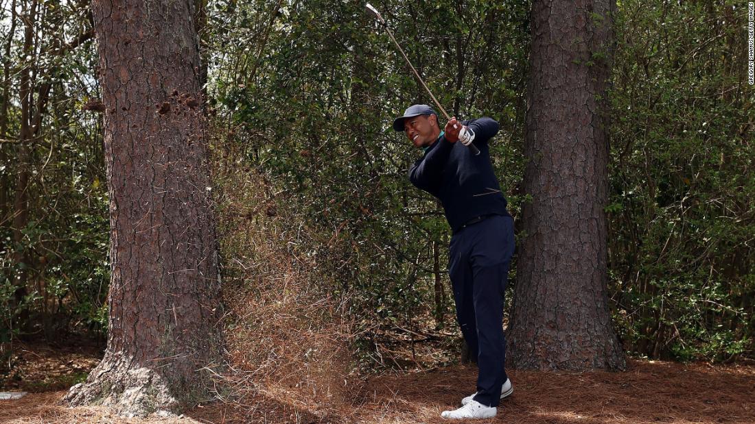 Woods plays a shot on the fifth hole on Friday. He had a rough start with four bogeys in his first five holes, but he recovered to finish with a 2-over-par 74.