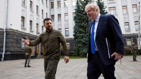 In this image provided by the Ukrainian Presidential Press Office, Ukraine's President Volodymyr Zelensky, left, welcomes Britain's Prime Minister Boris Johnson in Kyiv.