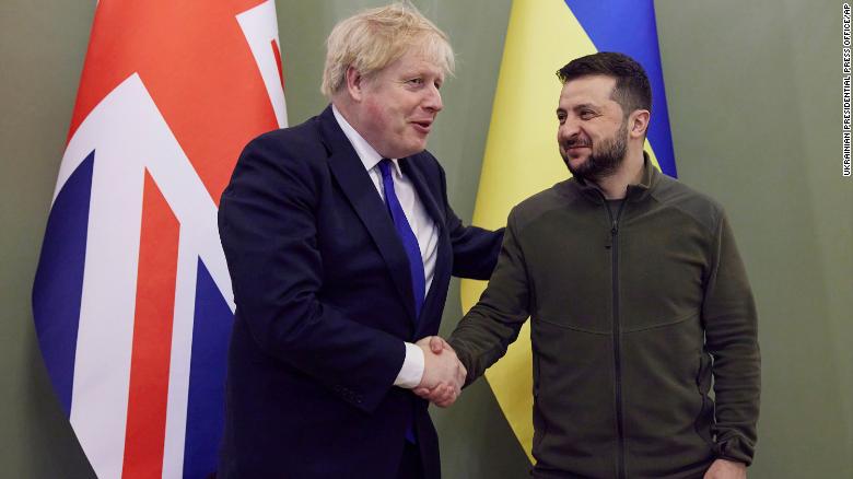 Ukrainian President Volodymyr Zelensky and Britain&#39;s Prime Minister Boris Johnson shake hands during their meeting in Kyiv.