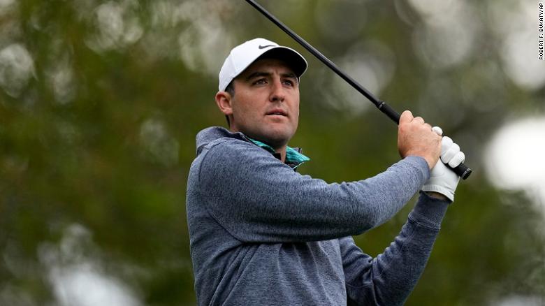 Scheffler watches his tee shot on the fourth tee during the third round at the Masters.