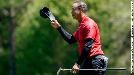 Woods tips his hat at the No. 12 tee during the final round of the Masters.