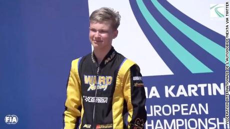Russian karting driver Artem Severiukhin on the podium.