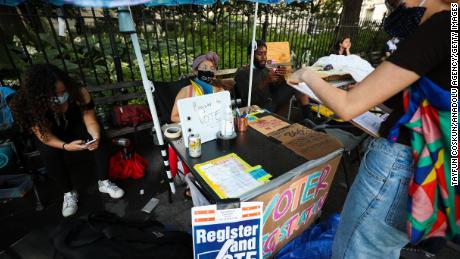 Voting registration stand is seen during the hundreds of Black Lives Matter protesters congregate at the City Hall in 2020 in New York.
