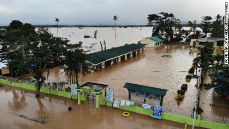 At least 25 dead in landslides and floods after Tropical Storm Megi hits the Philippines