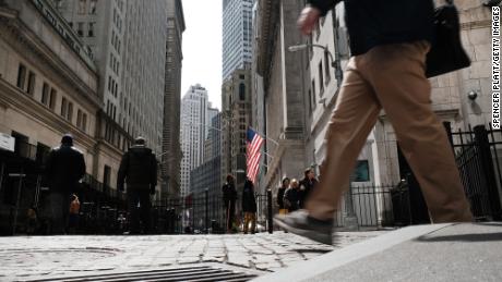 People walk by the New York Stock Exchange (NYSE) on April 04, 2022 in New York City. 