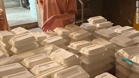 TC Pizza has prepared hundreds of boxed meals to donate to those in need.