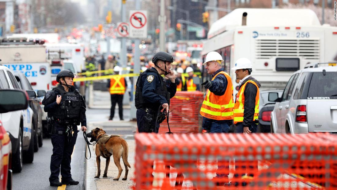 Officers with bomb-sniffing dogs patrol the area.