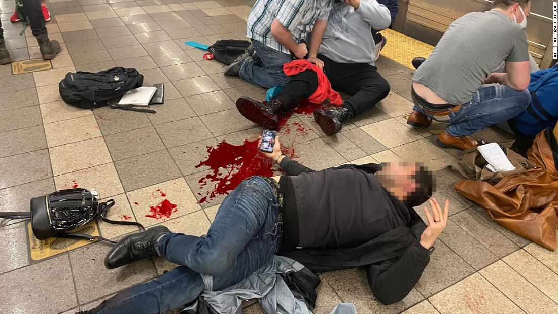 Injured people are seen on the platform of the 36th Street subway station on Tuesday. This photo was taken by photojournalist Derek French, who told CNN he leveraged his Red Cross first aid training to help victims. While helping them, French also discovered that he himself had been shot in the ankle and was bleeding. &lt;strong&gt;&lt;em&gt;Editor&#39;s note:&lt;/em&gt;&lt;/strong&gt;&lt;em&gt; A blur has been applied here by CNN to protect the identity of the victim.&lt;/em&gt;