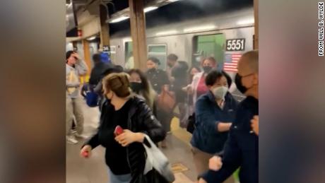 A quiet morning commute on a Brooklyn subway quickly became a 'war zone'  leaving more than 20 people injured, NYC mayor says 