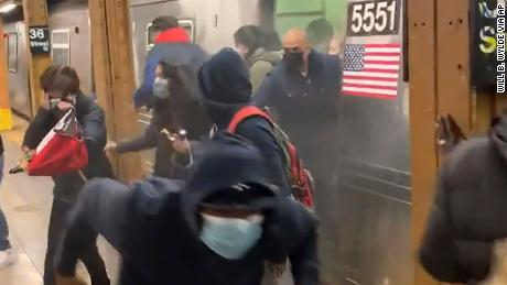 Smoke, bangs, then blood and panic: Riders describe being inside the subway car where 10 were shot