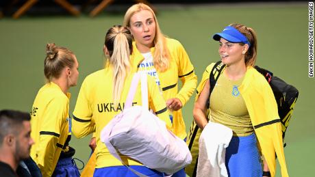 Katarina Zavatska chats with her team after her loss to American Jessica Pegula in the first round of qualifying for the 2022 Billie Jean King Cup.