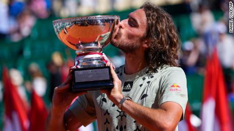 Stefanos Tsitsipas kisses his trophy after winning the Monte-Carlo Masters final against Spain&#39;s Alejandro Davidovich Fokina.