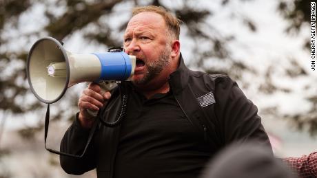 Right-wing conspiracy outlet Infowars files for bankruptcy as founder Alex Jones faces defamation lawsuits