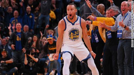 Steph Curry reacts after a basket and foul against the Denver Nuggets.