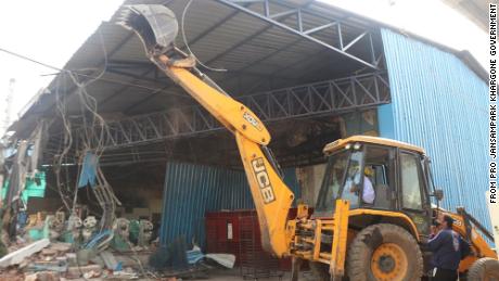 Khargone authorities demolish a facility following the violence.