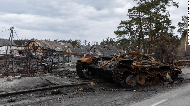 A destroyed Russian tank sits in the village of Dmytrivka, Ukraine.