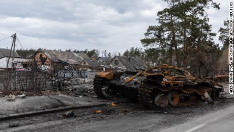 A destroyed Russian tank sits  in the village of Dmytrivka, Ukraine.