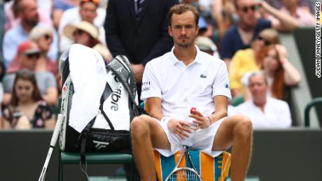 Daniil Medvedev sits between sets during the men's singles second round match against Carlos Alcaraz on the fourth day of Wimbledon 2021.