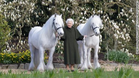 Queen Elizabeth II with her two Fell ponies, in a photo released to mark her 96th birthday.