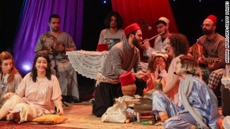 Actors perform in a play entitled &quot;law yerja Ramadan zaman,&quot; expressing longing for the Ramadan of olden days, by Palestinian director Awad Awad, at Al-Madina Theater in Lebanon&#39;s capital Beirut, late on April 20. The musical comedy introduces Ramadan traditions in a number of Arab countries, recollecting with much nostalgia the joy that marked the holy month of fasting in the Lebanese capital, currently mired in a severe economic crisis. 