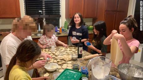 Merridith Cho says her daughters were excited to learn to make pierogis from one of the Ukrainian families who stayed with them. She says it was one of many beautiful moments of connection. CNN has blurred portions of this image to protect the Ukrainian family&#39;s identity.