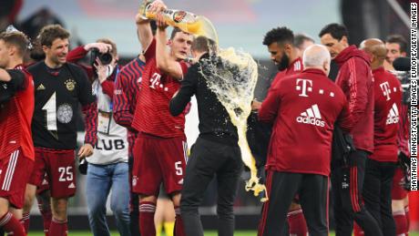 Julian Nagelsmann, 34, is showered in beer after winning his first league title. 