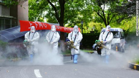 Workers disinfect the residential community during the CoVID-19 lockdown in Shanghai.