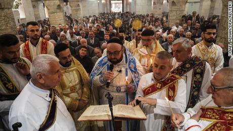 Priests lead Easter Mass for Syrian Orthodox Christians Sunday at Mart Shmoni Church in Bartella, east of Mosul in northern Iraq. 