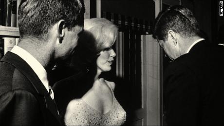 Marilyn Monroe with Robert Kennedy (left) and John Kennedy the night of the latter's birthday celebration in 1962.