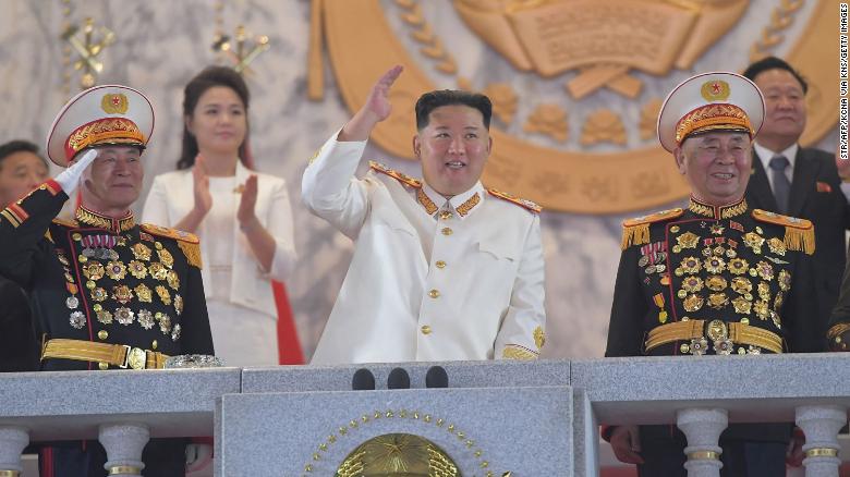 This picture taken on Monday and released from North Korea&#39;s official Korean Central News Agency on Tuesday shows North Korean leader Kim Jong Un, center, attending a grand military parade in Pyongyang.