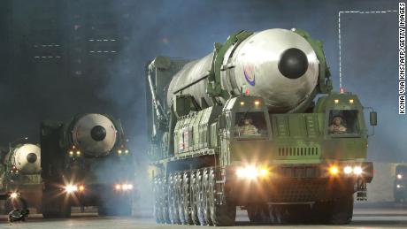 Kim Jong-un pledges full steam ahead for North Korea's nuclear program as he shows off ICBM missiles