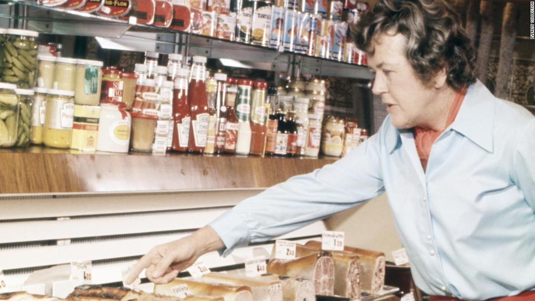 Child selects items at a charcuterie shop in the late 1970s.