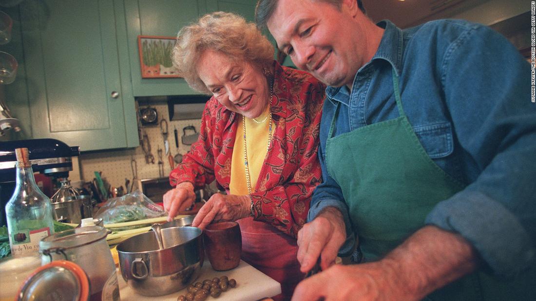 Child cooks with Jacques Pepin in her kitchen in Cambridge, Massachusetts, in 1998. The longtime friends shared a love of French food and even co-hosted a cooking show, &quot;Julia &amp;amp; Jacques Cooking at Home,&quot; that aired on PBS in 1999.