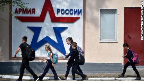 Children walk past the headquarters of the Operational Group of the Russian Troops in the town of Tiraspol last year.