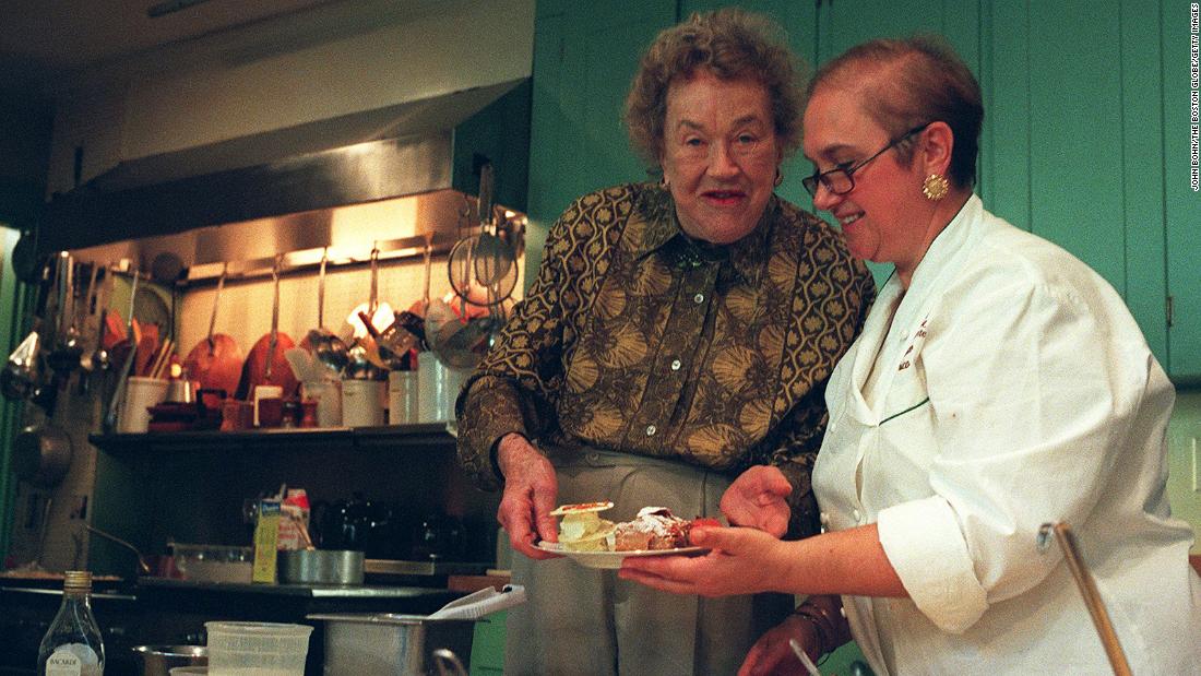 Lidia Bastianich, an Italian chef and restauranteur, prepares dessert with Child in 1999.