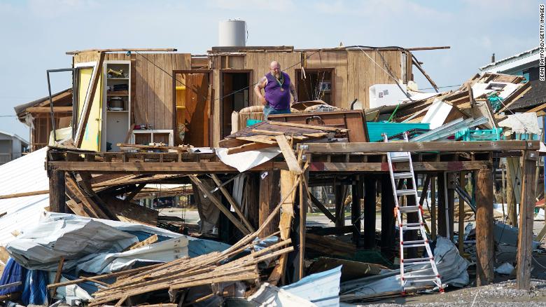 A Grand Isle, Louisiana, resident looks through his home after category 4 Hurricane Ida made landfall in August 2021.