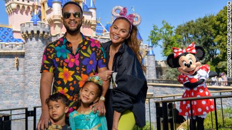 (Back row, left) John Legend and Chrissy Teigen and (front row, left) their two children, Miles and Luna, celebrate Luna's birthday at Disneyland on April 14 in Anaheim, California. 
