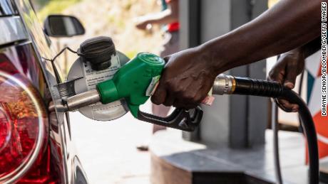 A worker refuels a vehicle at a Caltex gas station, operated by Chevron Corp., in Cape Town, South Africa, on Wednesday, March 23, 2022. 