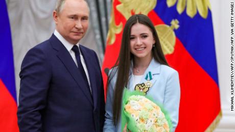 Putin poses with Valeeva during the award ceremony for the Beijing 2022 Winter Olympics medalists at the Kremlin in Moscow.