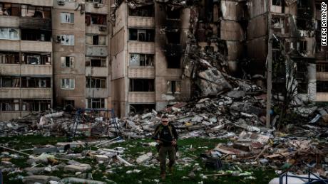 A Ukrainian soldier walks through the rubble of a building badly damaged by multiple Russian shelling near the front line in Kharkiv, Ukraine, on Monday.