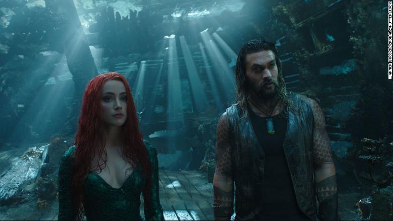 Amber Heard as Princess Mera and Jason Momoa as Aquaman. 