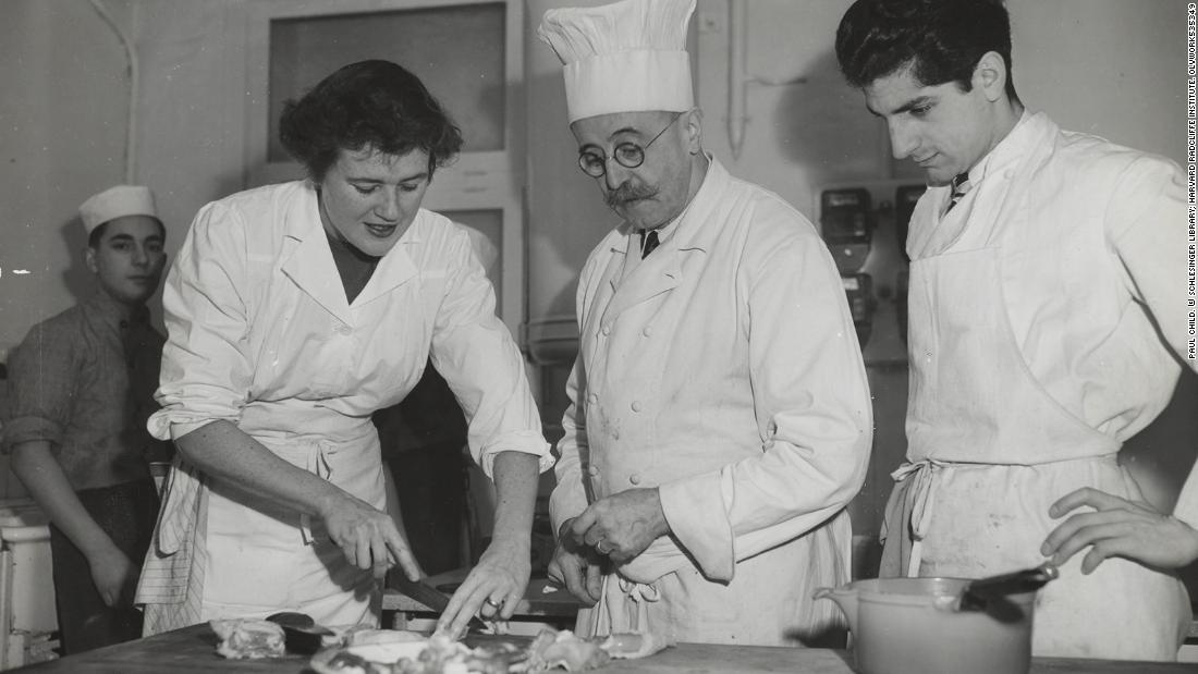 Child with other chefs and students at the Le Cordon Bleu cooking school in Paris in 1950. Child has said her first meal in France inspired her exploration of cooking and food.