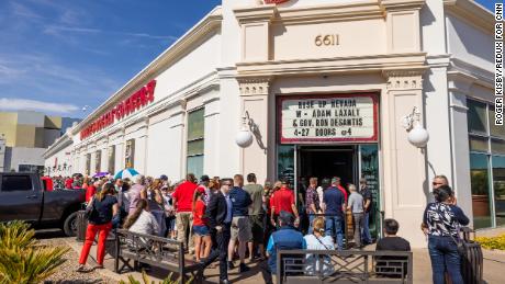 Attendees wait in line at Stoney's & # 39;  s Rockin'  Country in Las Vegas on April 27, 2022 before DeSantis'  His appearance with Senate candidate Adam Laxalt.