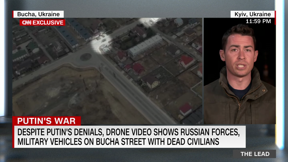 New drone video shows Russian military vehicles and troops on a Bucha street strewn with civilian bodies – CNN Video