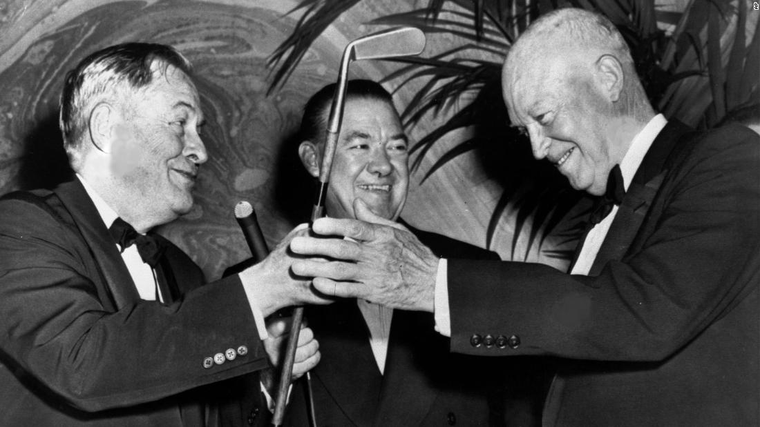 Legendary golfer Bobby Jones, left, presents a duplicate of his famous putter, Calamity Jane, to President Dwight D. Eisenhower at the dinner in 1959. In the center is Felix Belair Jr. of The New York Times.