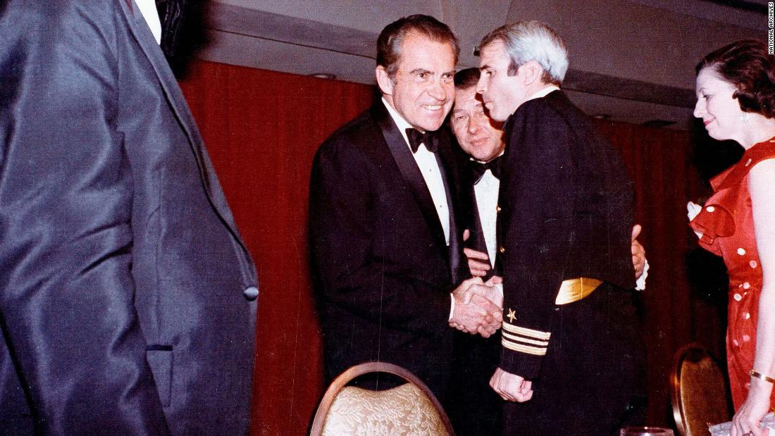 President Richard Nixon shakes hands with US Navy Lt. Cmdr. John McCain at the dinner in 1973. Just a month earlier, McCain had been released from a Vietnamese prison after being a prisoner of war for over five years.