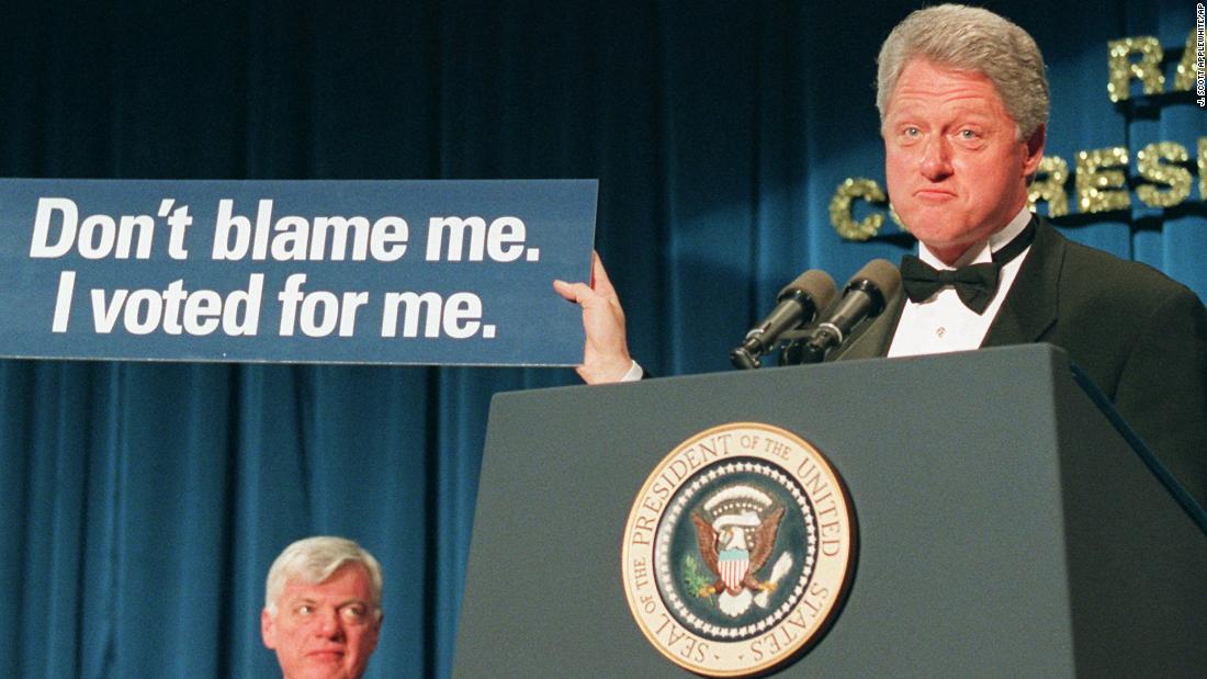 President Bill Clinton holds a placard proclaiming, &quot;Don&#39;t blame me. I voted for me,&quot; at the dinner in 1996. Clinton was auditioning some potential slogans for bumper stickers.