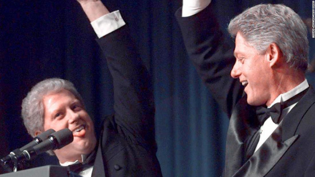 Clinton high-fives a &quot;clone&quot; of him played by actor Darrell Hammond in 1997.