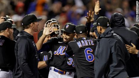 Pitcher Edwin Díaz celebrates with teammates after the Mets threw a combined no-hitter to defeat the Philadelphia Phillies 3-0 in New York.