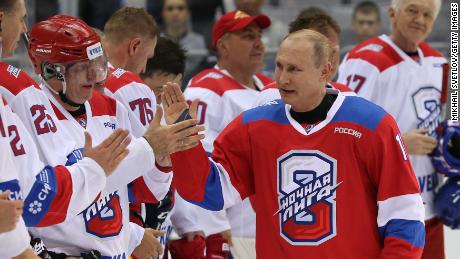 SOCHI, RUSSIA - MAY,10 (RUSSIA OUT) Russian President Vladimir Putin (C) greets billionaire and businessman Vladimir Potanin (L) as billionaire Gennady Timchenko (R) looks on during a group photo at the gala match of the Night Hockey League at Bolshoi Ice Dome in Sochi, Russia, May,10, 2019. Vladimir Putin scored 10 goals, and his team the Hockey Stars won 14:7 in this match against the Night Hockey League team.